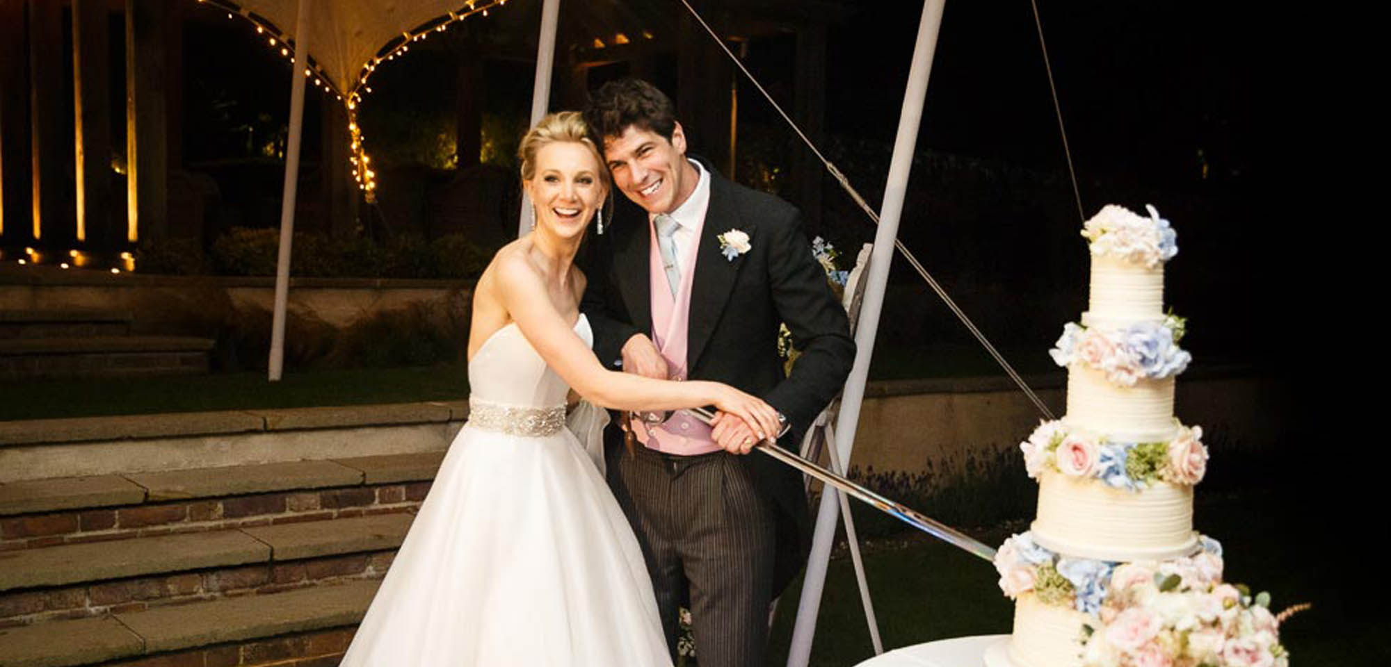 Wedding couple cutting a cake